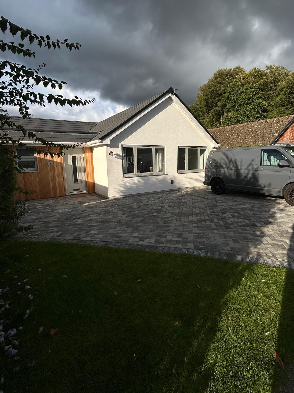 Renovated Dorset bungalow with new cedar cladding, windows and block-paved driveway by FR Carpentry
